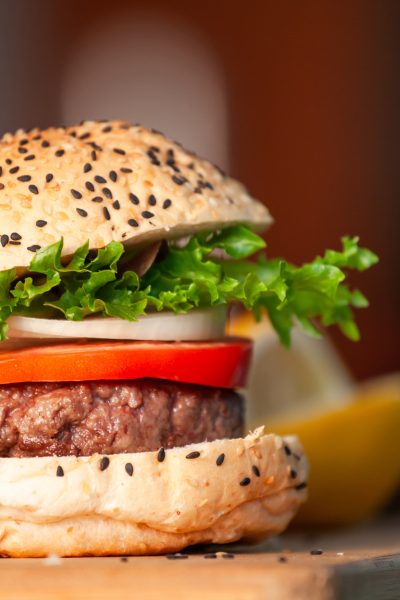 Delicious homemade hamburger with fresh vegetables in the kitchen ready for serve and eat