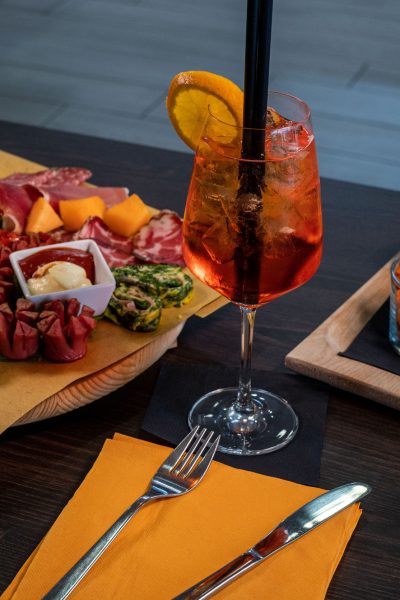 composition of mixed appetizer with coktail on a cutting board